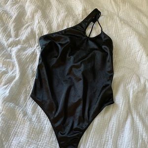 Black one shoulder body suit